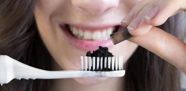 Brush your teeth with activated charcoal