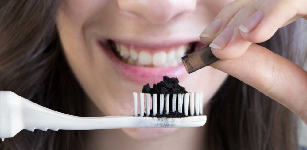 Brush your teeth with activated charcoal